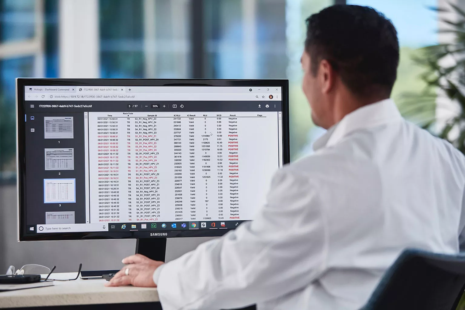 lab technician view data on a monitor in a lab setting.